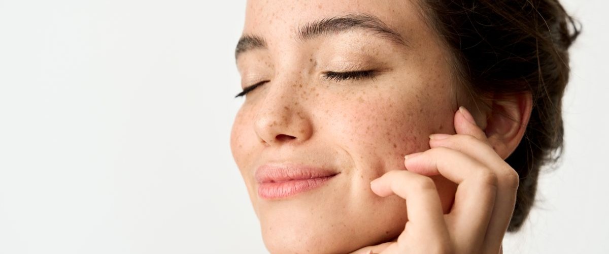 woman-touching-face-with-eyes-closed